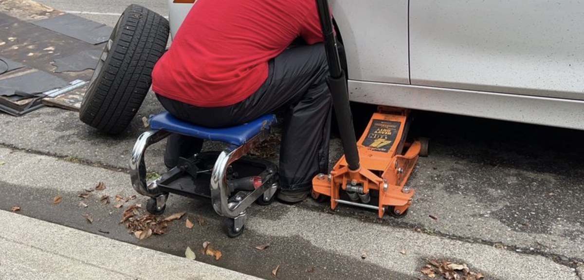 Wheel-off work at the curb on a Lubbock street